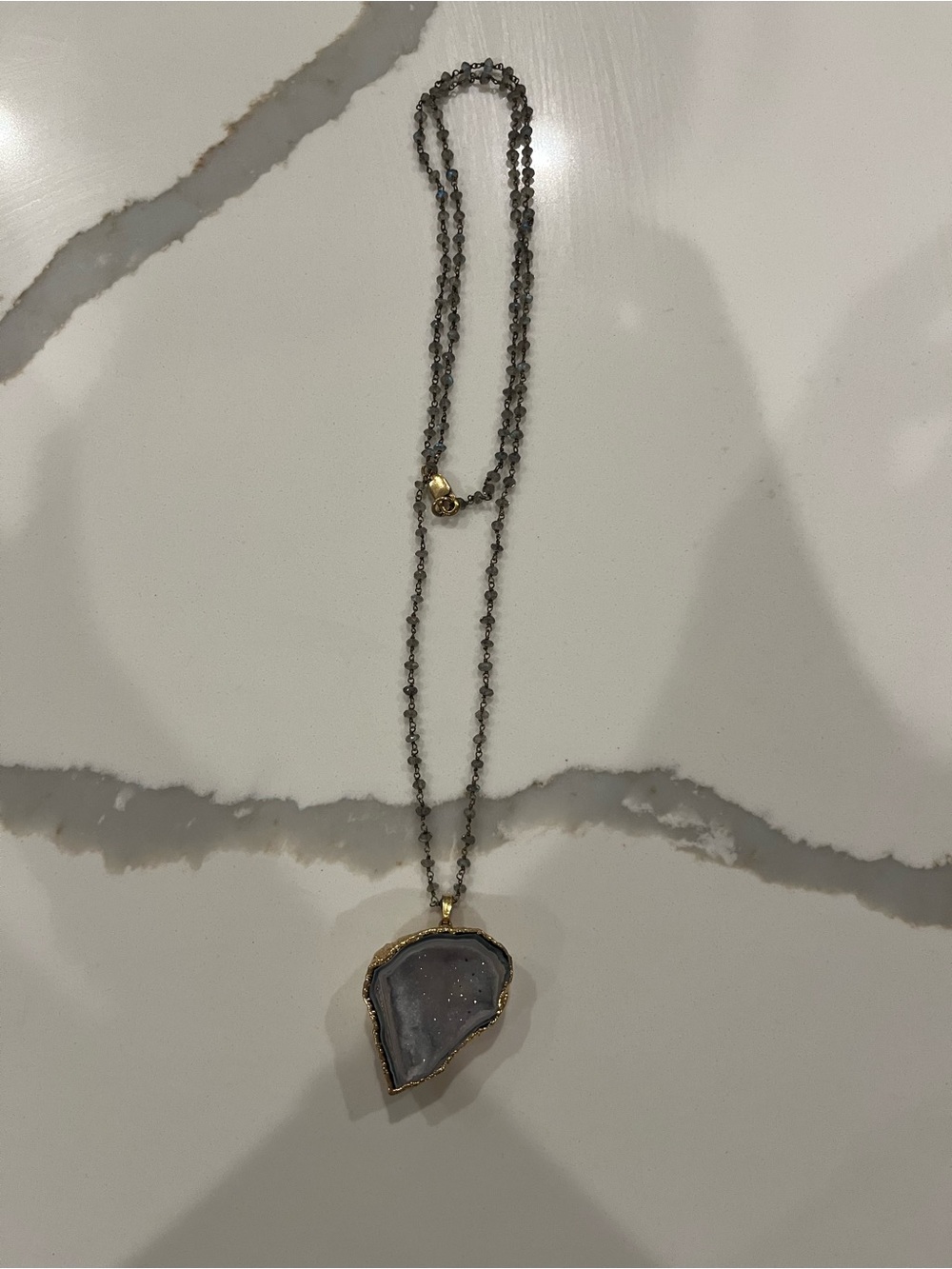 Gold tone, labradorite, and geode long necklace